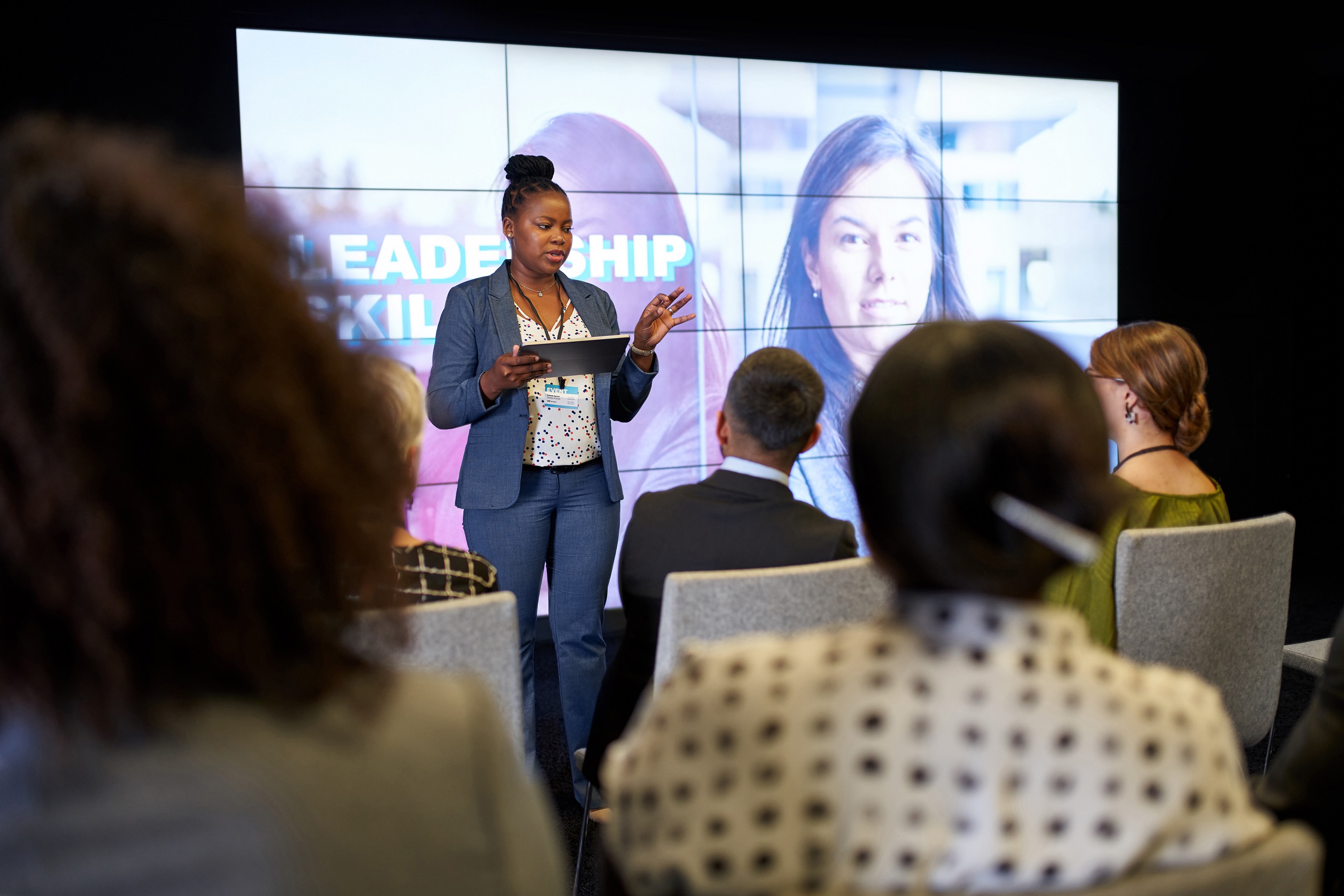 Save The Date For The 2024 Children S Justice Conference Washington   Women Presenting For Audience In Front Of Big Screen 